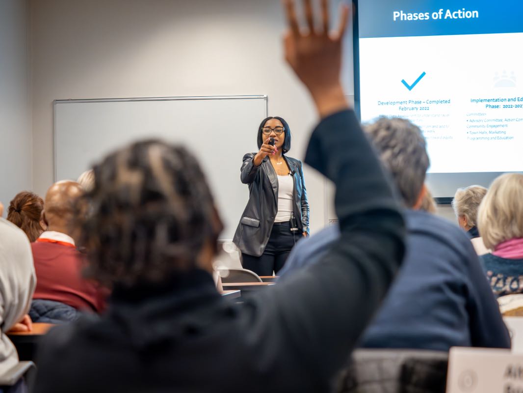 An instructor calls on a lifelong learner whose hand is raised