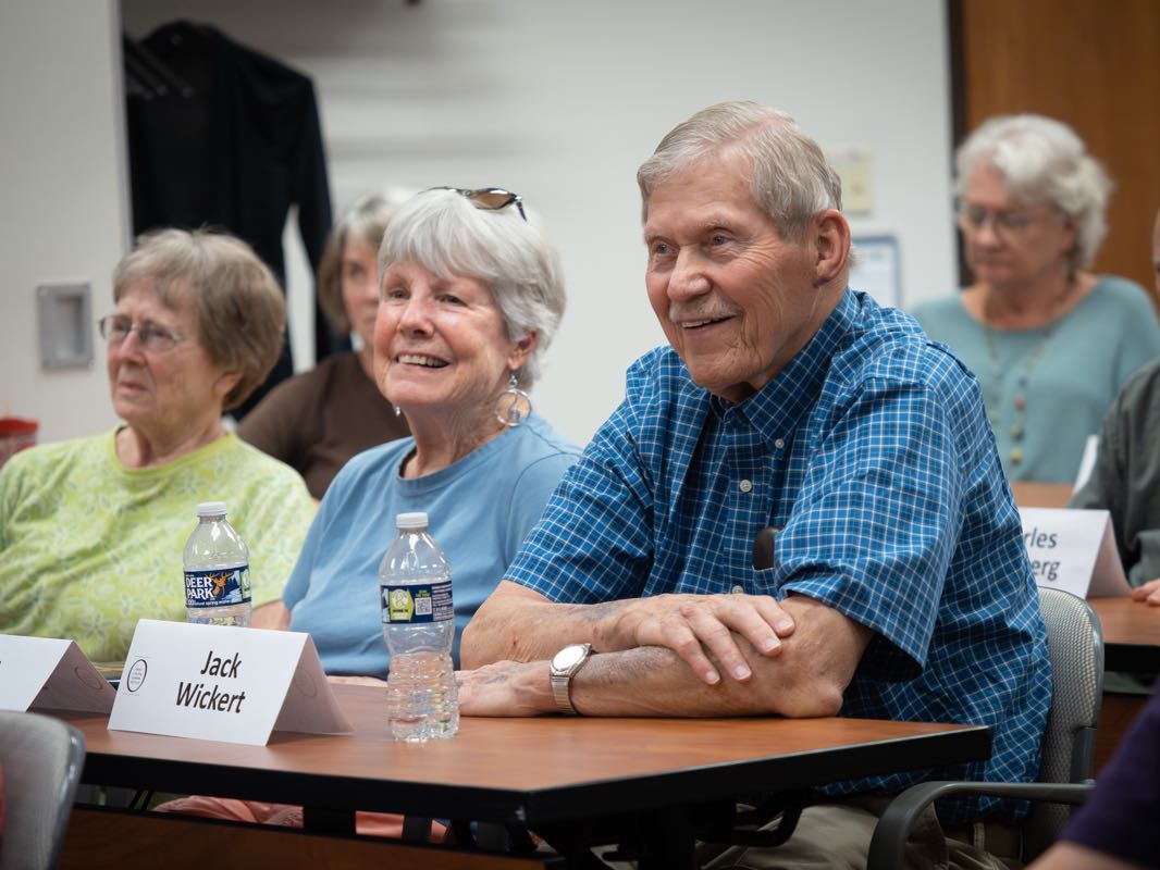 Two lifelong learners smiling in a classroom