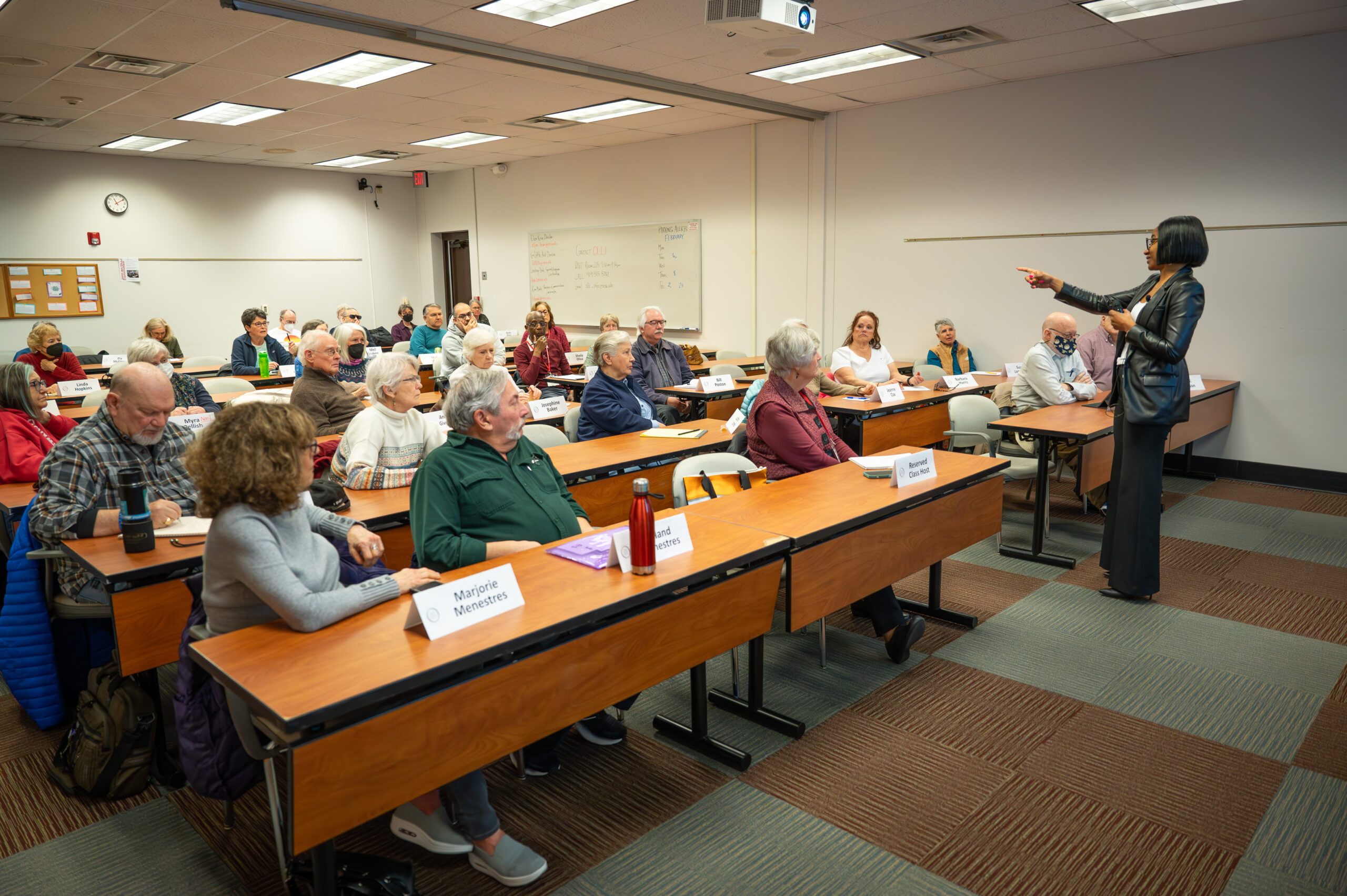 An Instructor teaching a group of OLLI students